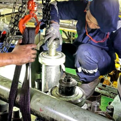 Enpro technician overhauling engine components